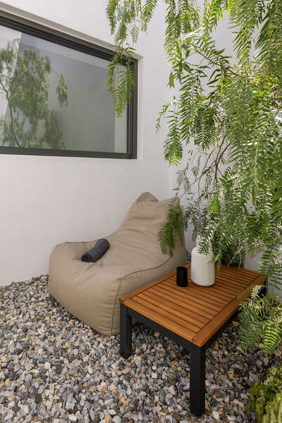 Outdoor lounge nook among the cacti