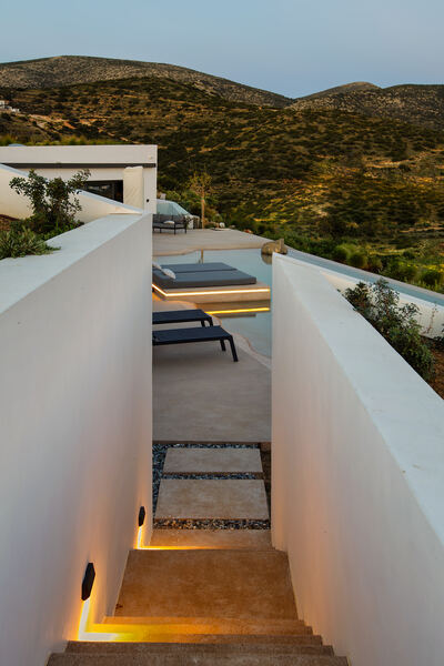 Lit stone steps leading through the garden