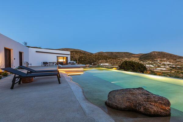 Poolside loungers lit for the evening