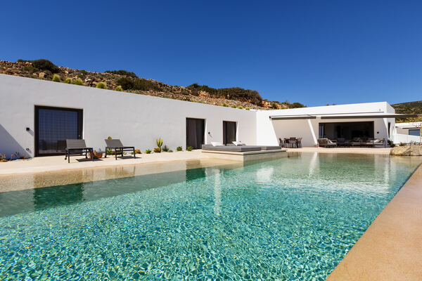 Pool and villa wing at dusk
