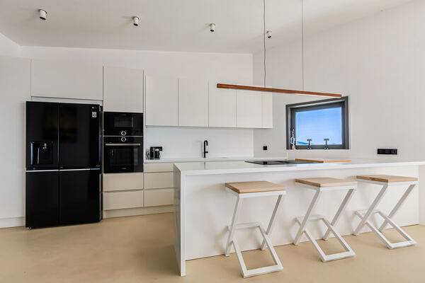 Open-plan kitchen with sea-view window
