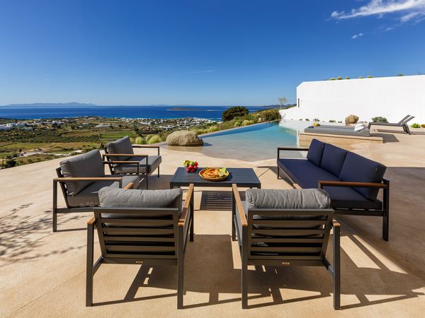 Outdoor lounge seating overlooking the Aegean