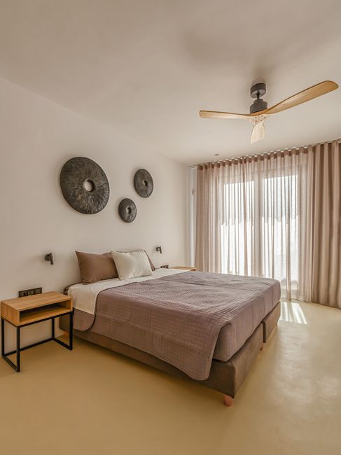 Bedroom with sculptural wall art