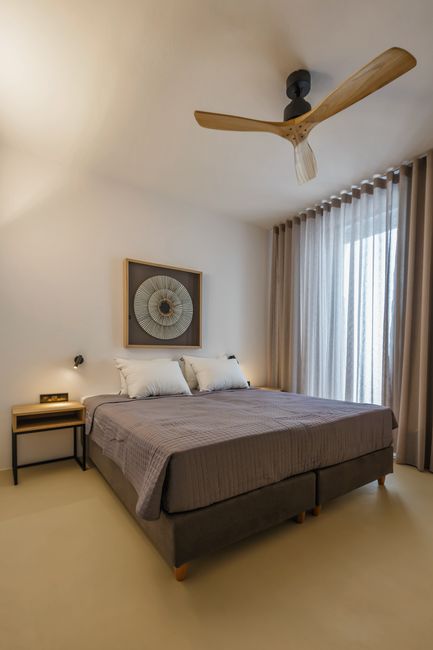 Bedroom with wood wardrobe and luggage rack